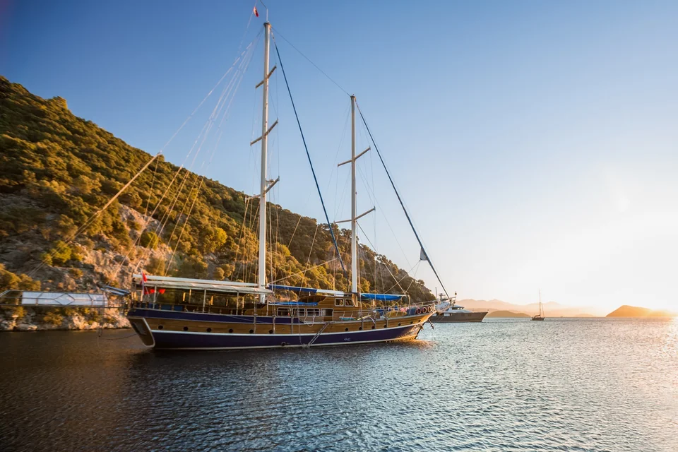 Traditional wooden gulet anchored in a bay